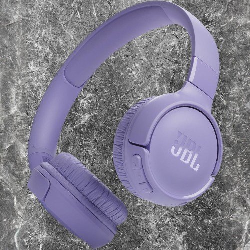 JBL Tune 520BT wireless headphones being worn by a model, showcasing comfort and sleek design.