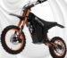 A Tuttio Soleil 01 electric dirt bike with a rugged frame and large 14"/12" fat tires, positioned on an off-road trail.
